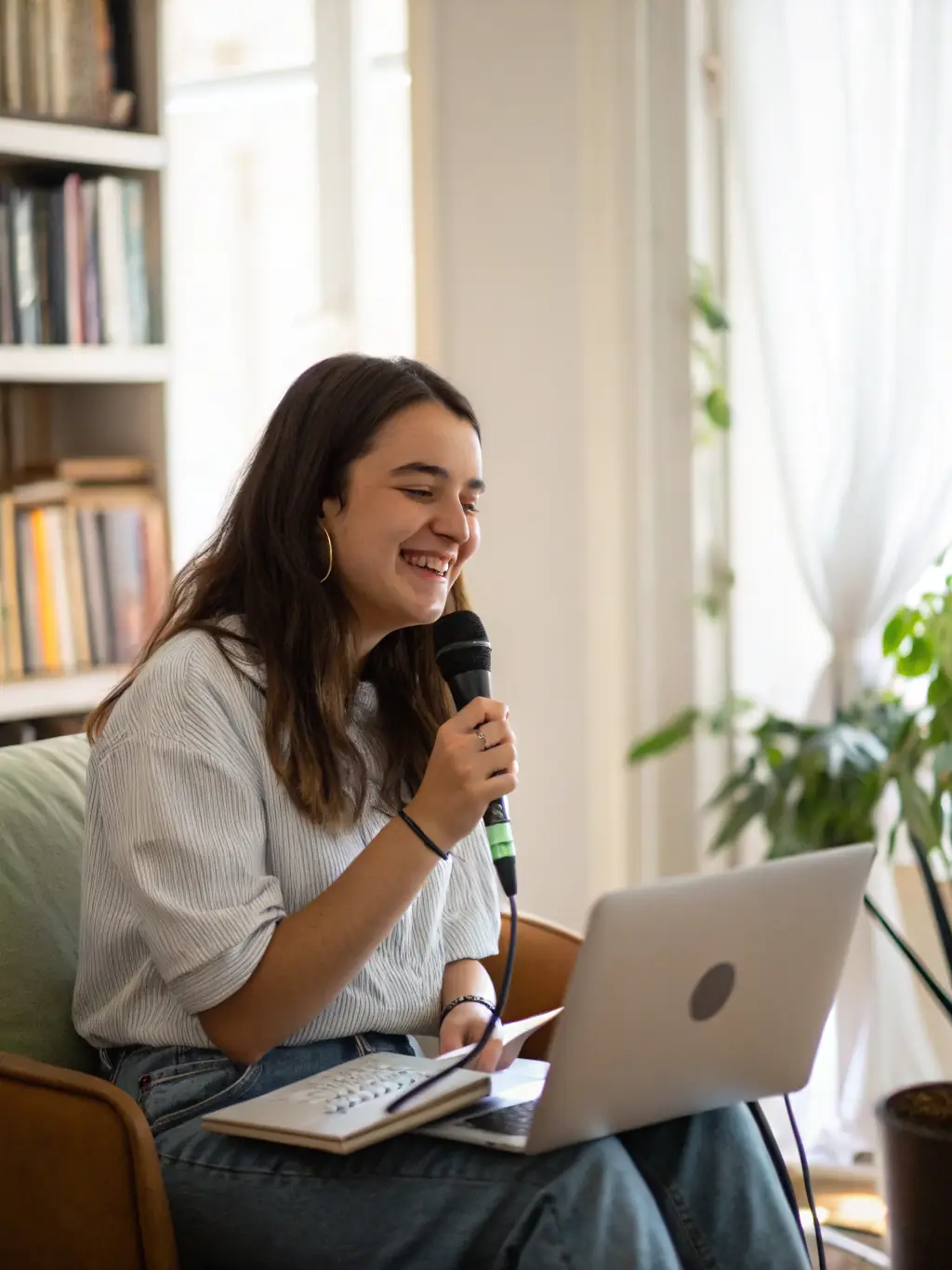 A customer testimonial video playing on a laptop screen, showcasing a satisfied commercial client sharing their positive experience with Saurmandal Solar.
